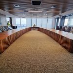 Custom Boardroom Table L9200 x W5000 in Australian Blackwood with integrated power and data. Compliant with strict human factors guidelines. Location- One The Esplanade, Elizabeth Quay, Perth Western Australia